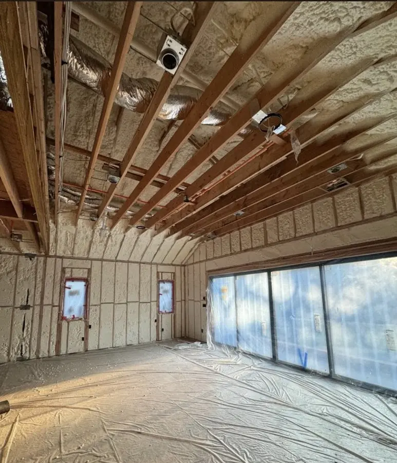 Interior walls and ceiling insulated with spray foam during new construction in Hiawatha